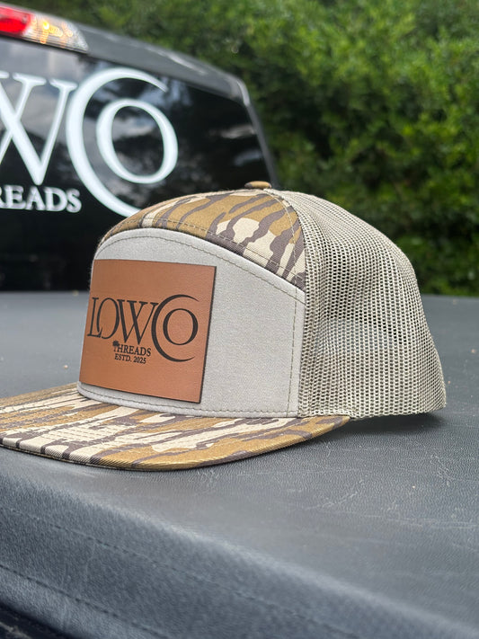 Richardson 168P Camo 7-Panel
Snapback Trucker Hat - Seven-
Panel Trucker Cap - Front Logo Leather Patch