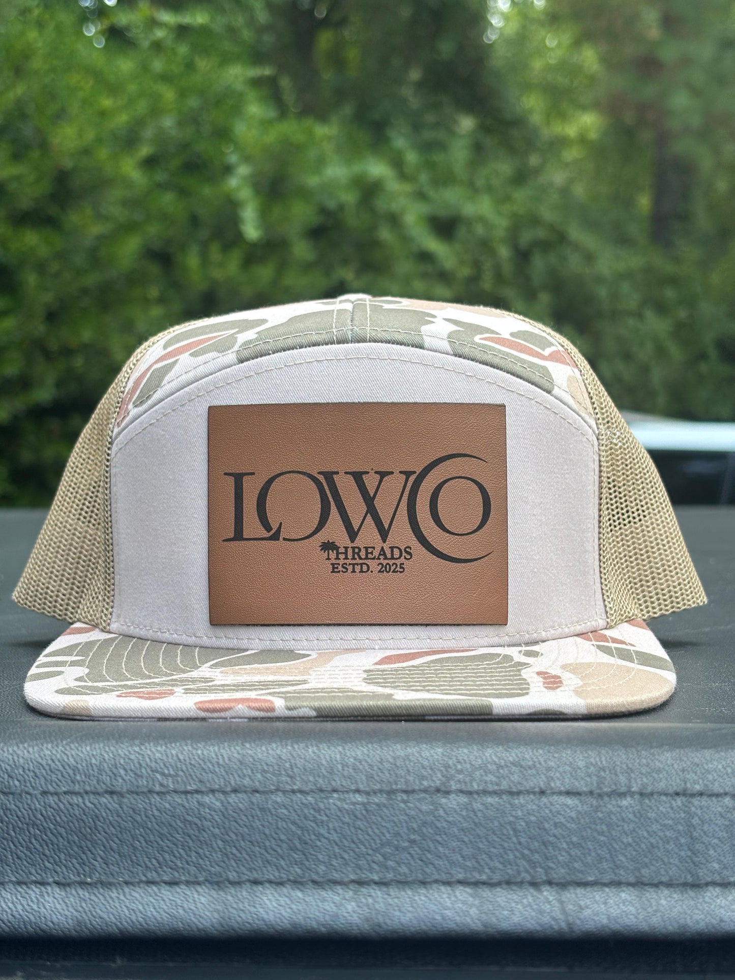 Richardson 168P Camo 7-Panel
Snapback Trucker Hat - Seven-
Panel Trucker Cap - Front Logo Leather Patch