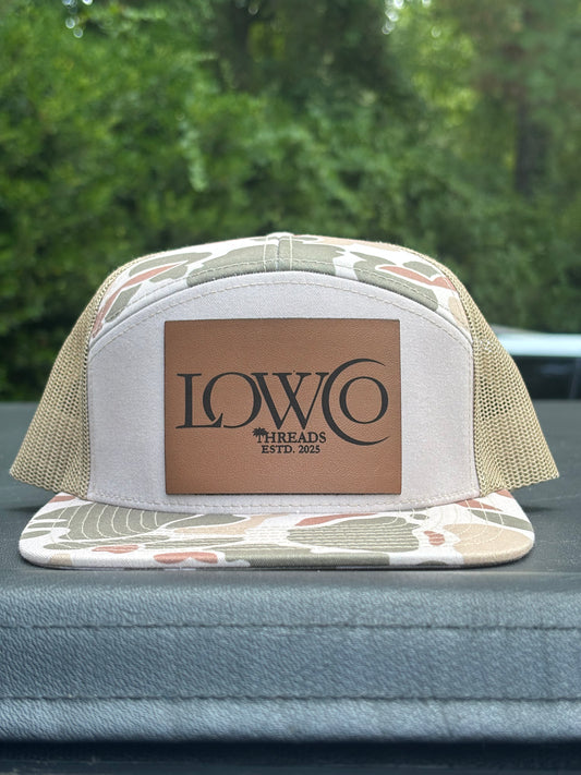 Richardson 168P Camo 7-Panel
Snapback Trucker Hat - Seven-
Panel Trucker Cap - Front Logo Leather Patch